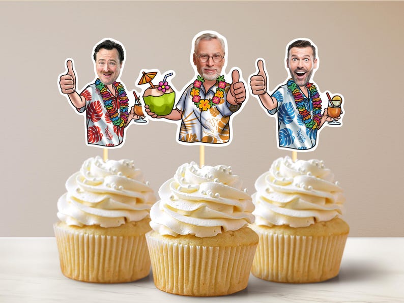 May include: Three cupcakes decorated with images of men wearing Hawaiian shirts and holding tropical drinks. The cupcakes are white with white frosting and white sprinkles.