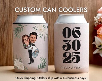 May include: Custom can coolers with a wedding theme. One cooler features a cartoon couple, the other displays the date "06 30 25" and the names "Olivia & Chad". Both coolers are beige with floral and leaf accents.
