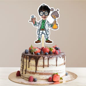 May include: A cake topper featuring a cartoon scientist wearing glasses and a lab coat, holding a test tube and a beaker. The scientist is standing on a cake decorated with chocolate frosting and fresh berries.