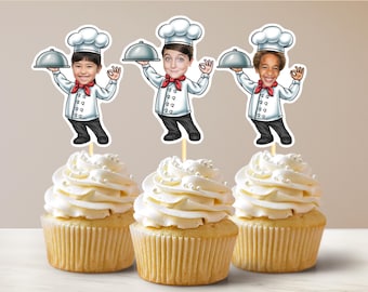 May include: Three cupcakes with white icing and sprinkles topped with chef-themed cake toppers featuring cartoon chefs with different facial expressions. The chefs are wearing white chef hats and red scarves. Each chef is holding a silver serving tray.