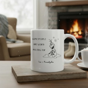 May include: White ceramic mug with a black illustration of Olaf from Frozen, with the text "SOME PEOPLE ARE WORTH MELTING FOR" and "Line 1: Personalization". The mug is on a wooden coaster, with a fireplace in the background.