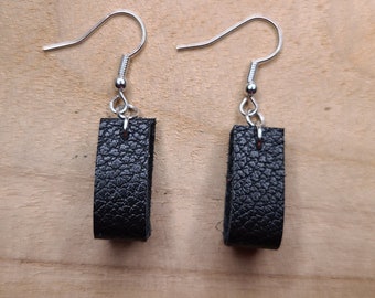 Mini leather black hoop earrings.