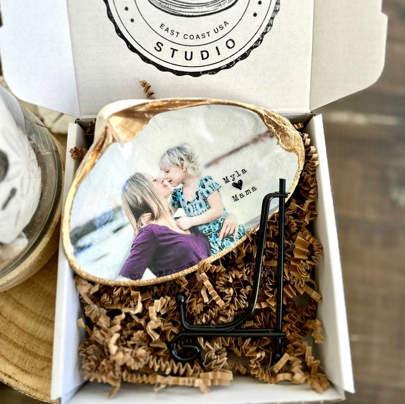 Mothers day gift photo in shell with gold trim and personalized wording.