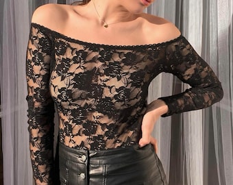 See through bodysuit lace and floral pattern. Black lace date night off shoulder bodysuit