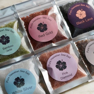 May include: Six small bags of Hawaiian sea salt, each with a different flavor and color. The flavors are Bamboo Jade, Red Gold, Black Lava, White Silver, Pink Diamond, and Smoked Kiawe.