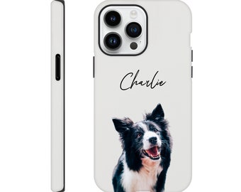 May include: White iPhone case with a black border and a black and white photo of a dog with the name "Charlie" printed on the case.