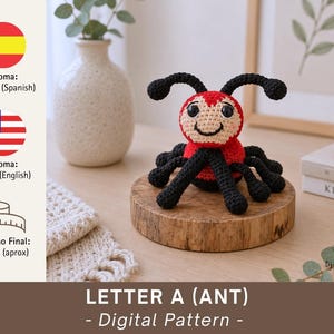 May include: A handmade crochet ant with a red body, black legs, and antennae. The ant has a smiling face with large eyes. The text "LETTER A (ANT) - Digital Pattern" is visible. The finished size is approximately 4.7 inches.