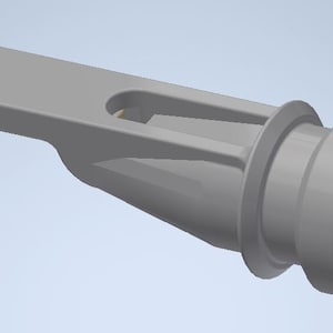 May include: A grey plastic nozzle with a long, flat handle and a round, flared opening. The nozzle has a small, rectangular opening on the top.