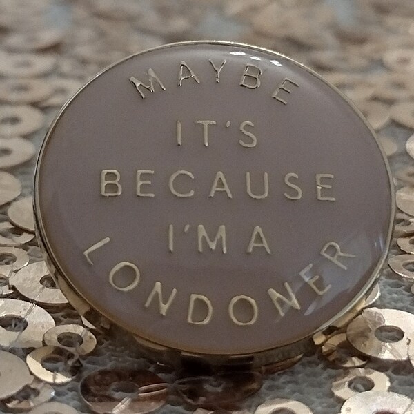 Vintage Burberry "Maybe it's because I'm a Londoner" gold tone pin brooch