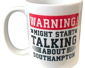 May include: White ceramic mug with a large handle. The mug features the text "WARNING! MIGHT START TALKING ABOUT SOUTHAMPTON" in black and red lettering. The mug is designed for hot beverages.