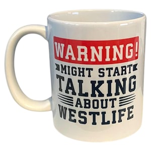 May include: White ceramic mug with a curved handle. The mug features the text "WARNING! MIGHT START TALKING ABOUT WESTLIFE" in black and red lettering. The mug is designed for coffee or tea.