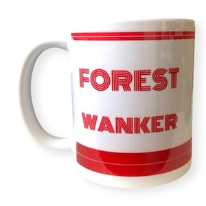 May include: White ceramic mug with red stripes and the text "FOREST WANKER" in red.