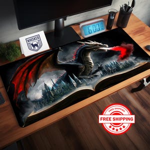 May include: A black dragon with red wings emerges from a large open book, breathing fire. The book is set against a dark background with a castle in the distance. The dragon's eyes are glowing red.