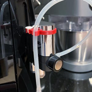Soporte de manguera para cafetera Jura E8