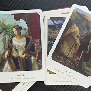 May include: A collection of tarot cards featuring classical art. One card shows a woman in a fur-trimmed coat, labeled "ROYAL." Another depicts a giant carrying a person, labeled "GIANT." The cards have white borders and text at the bottom.