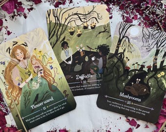 May include: Three tarot cards with illustrations and text. The cards feature images of women, flowers, and mushrooms. The text on the cards includes the words "Flower wand", "Daffodils", and "Mushrooms". The cards are surrounded by dried flower petals.