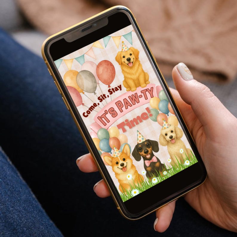 May include: A smartphone displays a colorful invitation for a dog-themed party. The invitation features illustrations of dogs, balloons, and the text "Come, Sit, Stay, It's PAW-TY Time!" in a playful font. The phone is held in a person's hand.