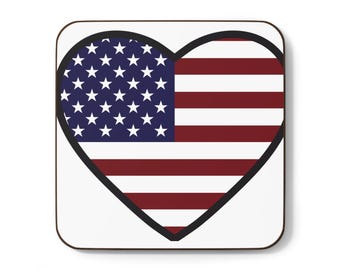 May include: A heart-shaped coaster with a red, white, and blue American flag design. The coaster has a black outline.