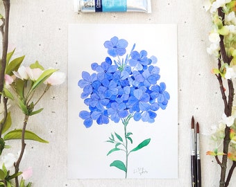 May include: Watercolour painting of a bunch of blue flowers with green stems and leaves. The painting is on white paper and has the artist's signature in the bottom right corner.