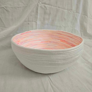 Rope Basket Hand Sewn 9 inches wide x 3.5 inches deep with pink thread accents. Great for decor also functional, holds your favorite items.
