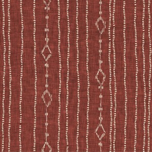 May include: A close-up of a textured fabric with a rust-colored background. Vertical lines of small, white dots run across the fabric. Interspersed are lines of white diamond shapes connected by short lines, creating a geometric pattern.