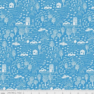 May include: Blue fabric with a white illustrated pattern of a town scene. The design includes houses, cars, trees, bridges, and clouds. The pattern repeats across the fabric. The image includes a ruler with inches.