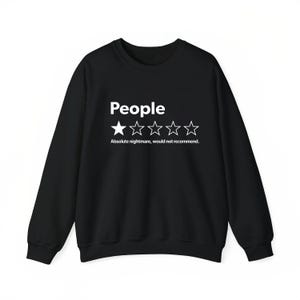 A black sweatshirt with white text and stars on it.