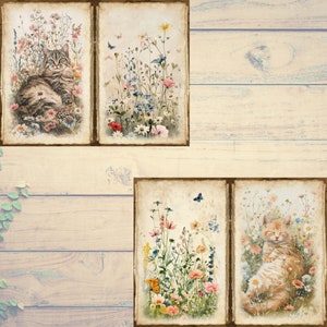 May include: Four framed watercolor prints featuring cats and wildflowers. Two prints show cats nestled in flowers, while the other two depict colorful wildflowers and butterflies. The prints have a vintage, aged paper appearance.