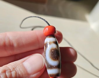 Heaven and earth dzi bead, with old Tibetan coral