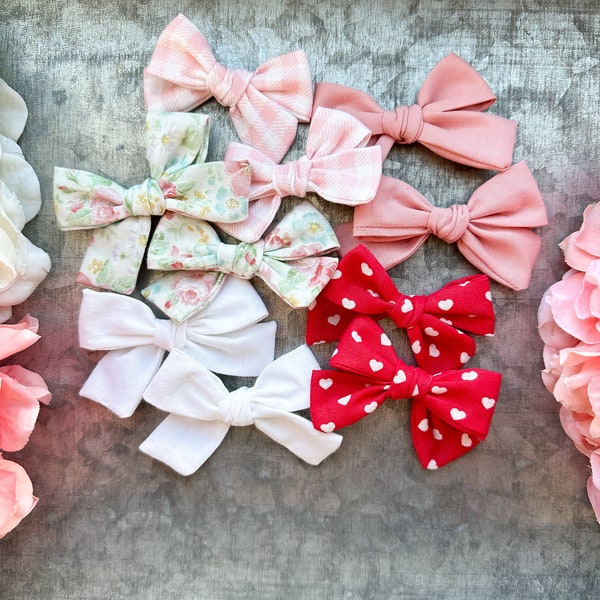 Newborn bows, mini bows, infant bows, nylon headbands, baby headbands, baby girl bows