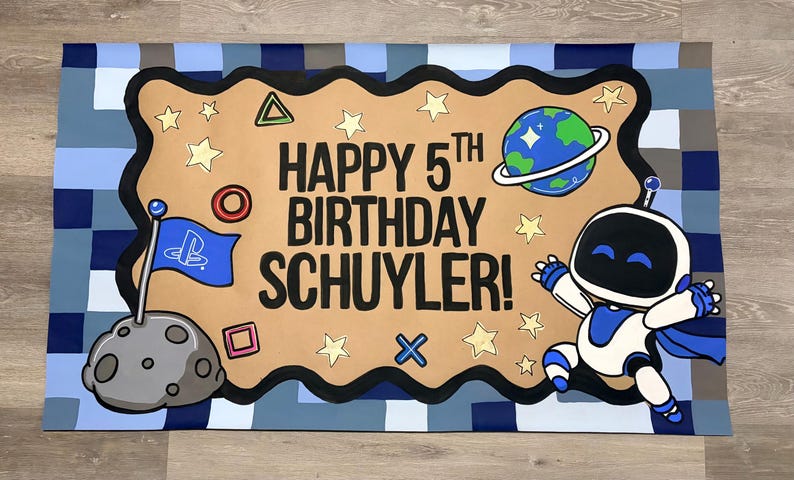 May include: A rectangular banner with a blue pixelated border featuring the text HAPPY 5TH BIRTHDAY SCHUYLER! in black. The design includes a grey moon with a blue flag, a cartoon robot, a planet with rings, and various yellow geometric shapes.