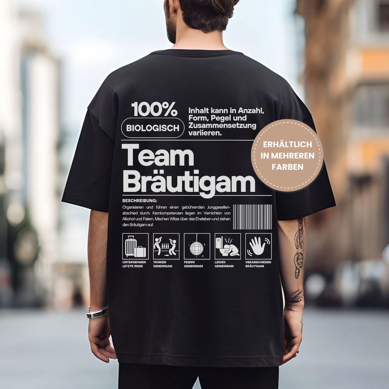 Puede incluir: Camiseta negra con texto y gr&aacute;ficos blancos. El texto incluye "100% BIOLOGISCH Team Br&auml;utigam" y varios iconos. Un gr&aacute;fico circular indica "DISPONIBLE EN M&Aacute;S COLORES". La camiseta es de estilo casual.
