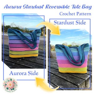 May include: A reversible crochet tote bag with the text "Aurora Stardust Reversible Tote Bag Crochet Pattern". The bag features a striped design in shades of blue, purple, pink, yellow, and green. The bag has blue handles and is displayed on a wooden surface.