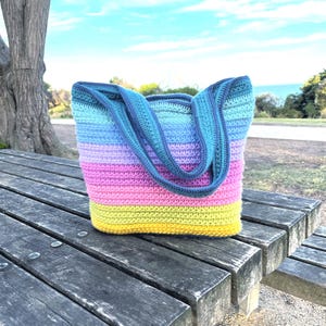 Aurora Stardust Reversible Tote Bag crochet pattern – digital PDF pattern for a stylish, two-in-one handmade tote bag. Features a colorful, textured stitch design with clear step-by-step instructions and photo guides. Perfect for everyday use, shopping, or as a unique gift. This easy-to-follow crochet pattern is beginner-friendly and instantly downloadable. A fun and creative DIY bag project for crochet lovers