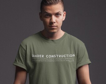 May include: A green t-shirt with the text "UNDER CONSTRUCTION" and a quote about Jesus Christ.
