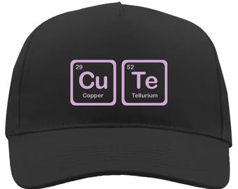 May include: Black baseball cap with a pink design of the chemical elements copper (Cu) and tellurium (Te) with their atomic numbers and names.