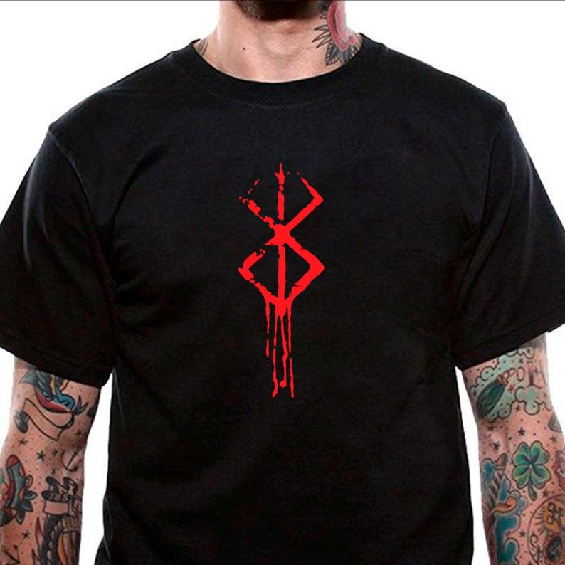 May include: Black t-shirt with a red graphic of the "Berserk" manga series symbol. The symbol is a stylized, dripping blood-like design.