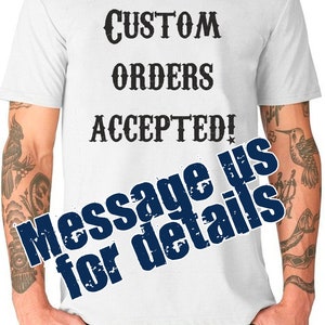 May include: White t-shirt with black text that reads "CUSTOM ORDERS ACCEPTED! Message us for details".