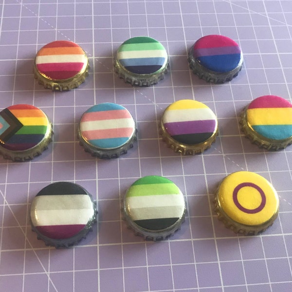 Pride flag pin badge made from bottle top, LGBTQ+ identity.