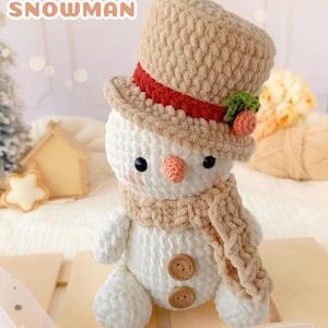 Easy pattern for a simple, low-sew Amigurumi Snowman plushie • Soft and cuddly Christmas crocheted item.