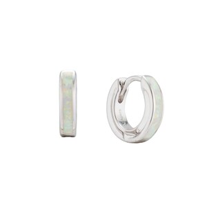 Iridescent white opal inlay huggie hoops. Rhodium-plated dainty silver earrings developed by Maison Noora. Ready-to-gift opal jewelry