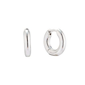 Small 3mm thick silver huggie hoops bathed in rhodium. Minimalist stacking NANA earrings developed by Maison Noora. Ready-to-gift jewelry