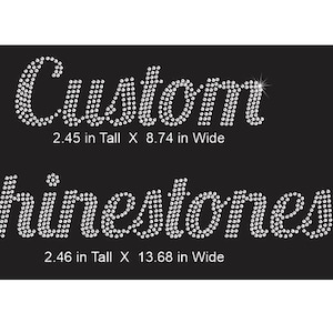 May include: A black background featuring the word Custom in white rhinestones, measuring 2.45 inches tall by 8.74 inches wide, and the word Rhinestones in white rhinestones, measuring 2.46 inches tall by 13.68 inches wide.