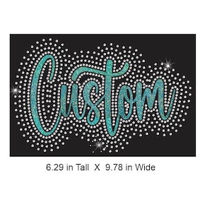 May include: A black iron-on transfer featuring the word Custom in a teal glitter script font, surrounded by a dense pattern of clear rhinestones. The design measures 6.29 inches tall by 9.78 inches wide, creating a sparkling effect.