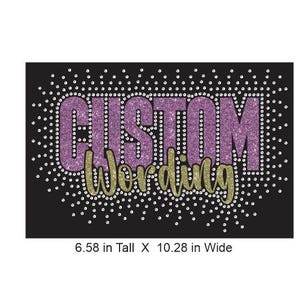 May include: A black rectangular iron-on transfer featuring the text CUSTOM in purple glitter and Wording in gold glitter, surrounded by a border of small white rhinestones. The design measures 6.58 inches tall by 10.28 inches wide.