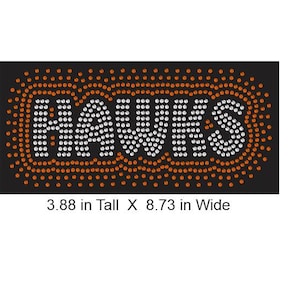 May include: Black rectangular design with the word "HAWKS" spelled out in white rhinestones. The word is outlined with orange rhinestones. The design is 3.88 inches tall and 8.73 inches wide.