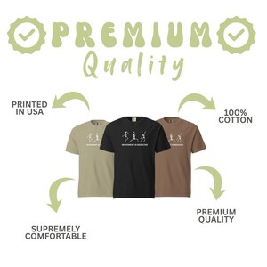 May include: Three t-shirts in olive green, black, and brown, each with a white graphic of stick figure yoga poses and the text "MOVEMENT IS MEDICINE." The shirts are labeled "100% COTTON" and "SUPREMELY COMFORTABLE."