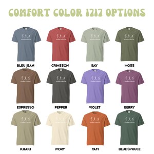 May include: A display of twelve Comfort Color t-shirts in various colors, including blue, red, green, brown, and purple. Each shirt features a white graphic and text. The text "COMFORT COLOR 1212 OPTIONS" is at the top.