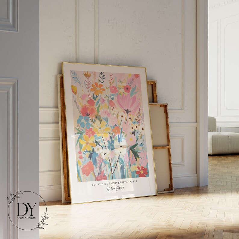May include: A framed print of a colorful floral illustration with a pink background. The print includes the text "55, Rue de L'Universite, Paris" and "H. Matisse".
