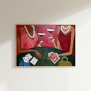 May include: An abstract painting depicts two figures at a table playing cards. The figures wear red dresses and pearl necklaces, holding martini glasses. A green table displays playing cards, dice, and a purse.